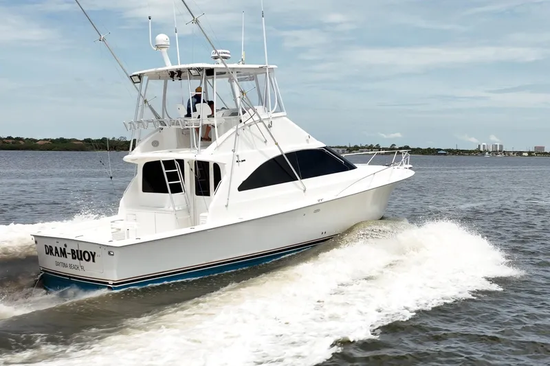 Slide: The Image of Ocean Yachts 43 Super Sport 2000 cruising on water, showcasing sleek design and performance. - 4