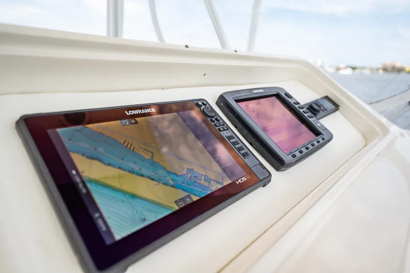 Slide: The Image of Navigation screens on a 2000 Ocean Yachts 43 Super Sport boat dashboard. - 8