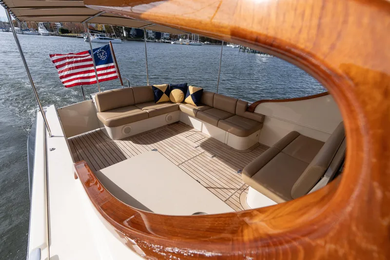 Slide: The Image of Luxurious 2016 Palm Beach Motor Yachts PB50 with elegant seating and American flag. - 26
