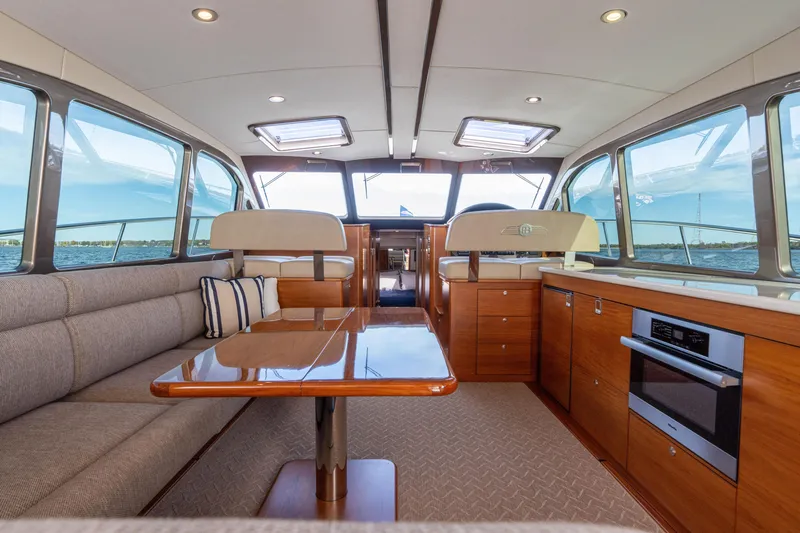 Slide: The Image of Luxurious interior of 2016 Palm Beach Motor Yachts PB50, featuring elegant wood finishes and modern amenities. - 40
