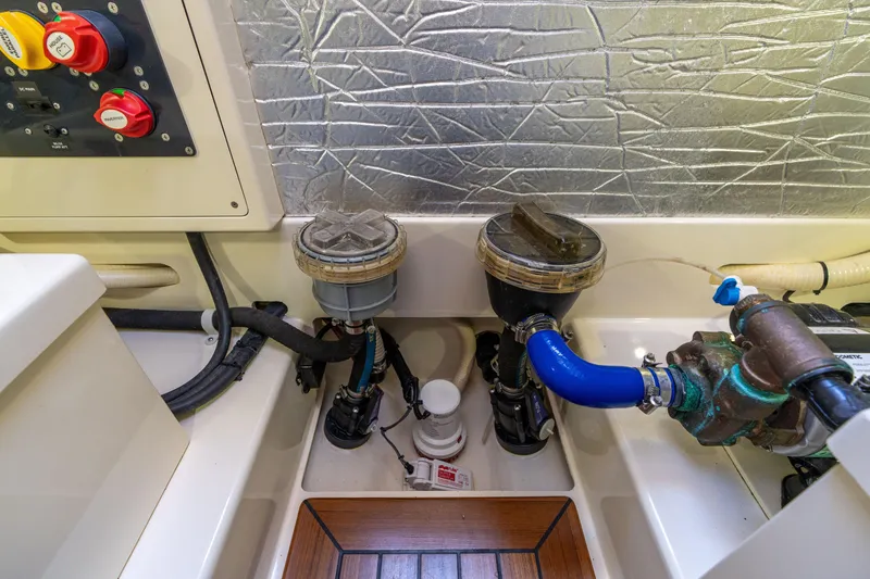 Slide: The Image of Engine room of 2016 Palm Beach Motor Yachts PB50 with mechanical components and wiring. - 52