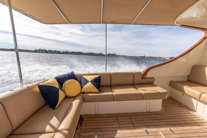 Slide: The Image of Luxurious 2016 Palm Beach Motor Yachts PB50 interior with elegant seating and scenic water view. - 55