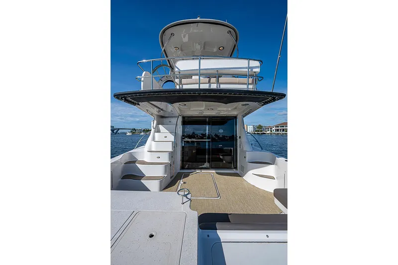 Slide: The Image of 2010 Sea Ray 520 Sedan Bridge yacht with spacious deck and elegant design. - 19