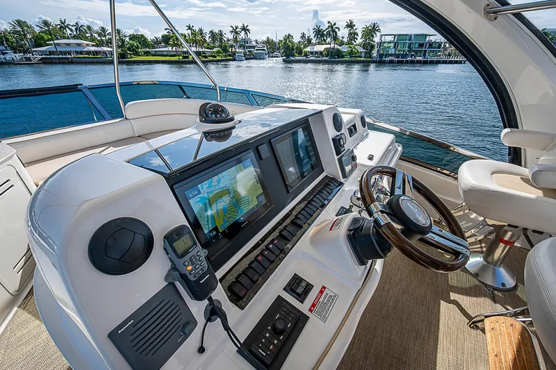Slide: The Image of Luxurious helm of 2010 Sea Ray 520 Sedan Bridge yacht with advanced navigation system. - 24