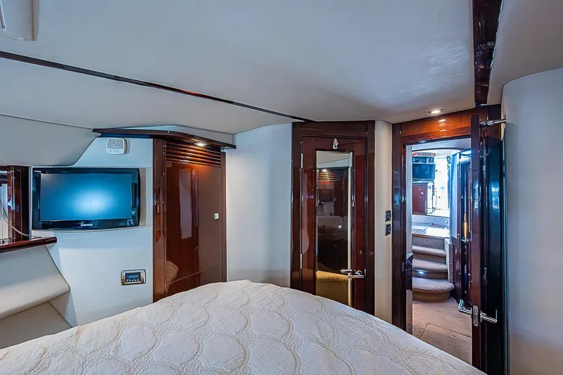 Slide: The Image of Luxurious interior of 2010 Sea Ray 520 Sedan Bridge yacht with TV and elegant wood finishes. - 50