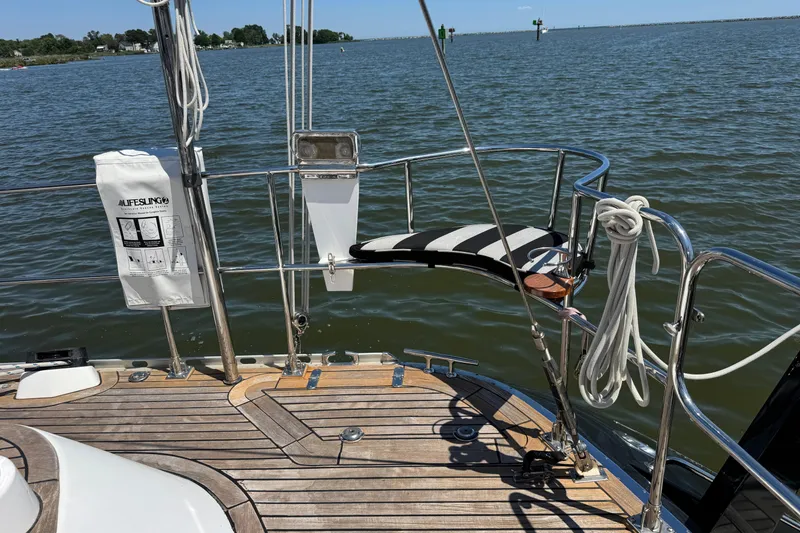 Slide: The Image of Deck of 2007 Hylas H49 yacht with lifesaving equipment, overlooking calm waters. - 67