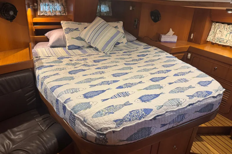 Slide: The Image of Cozy cabin interior of 2007 Hylas H49 yacht with fish-patterned bedding. - 39