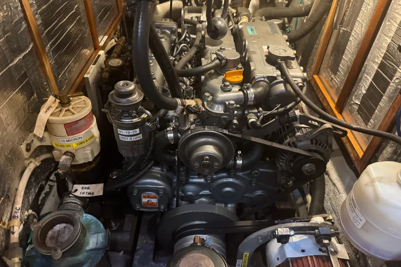 Slide: The Image of Engine compartment of a 2007 Hylas H49 yacht, showcasing detailed mechanical components. - 47