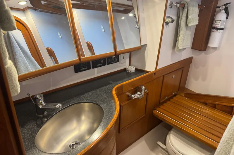 Slide: The Image of Luxurious bathroom interior of 2007 Hylas H49 yacht with wooden accents and modern fixtures. - 12