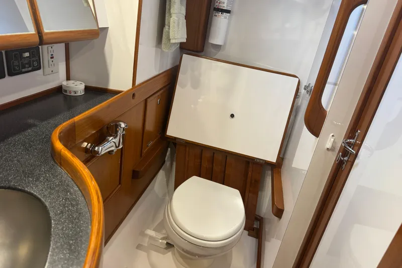 Slide: The Image of Luxurious 2007 Hylas H49 yacht bathroom with wooden accents and modern fixtures. - 13