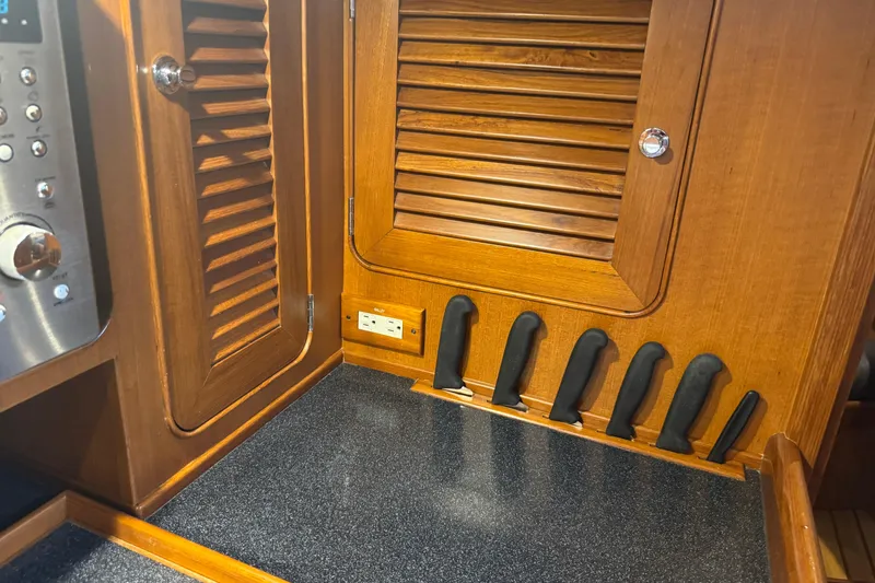 Slide: The Image of Wooden kitchen interior of 2007 Hylas H49 yacht with knife holder and outlet. - 29