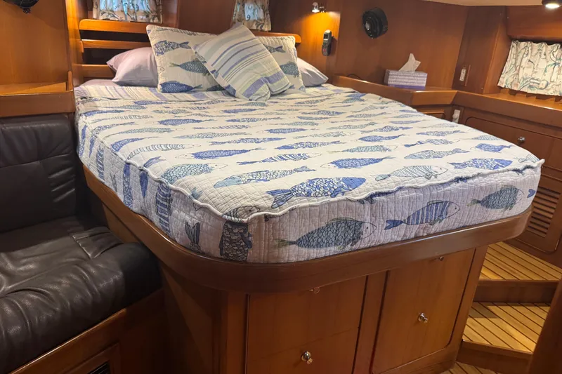 Slide: The Image of Cozy cabin interior of 2007 Hylas H49 yacht with fish-patterned bedding. - 37