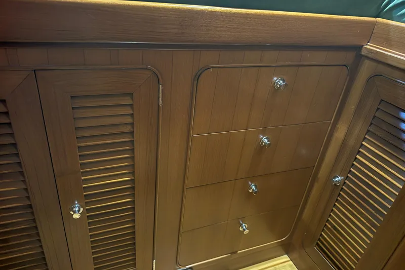Slide: The Image of Wooden cabinetry with drawers and louvered doors on a 2007 Hylas H49 yacht. - 11