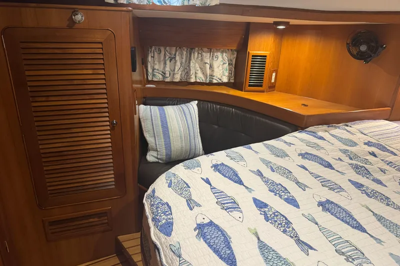 Slide: The Image of Cozy cabin interior of 2007 Hylas H49 yacht with fish-patterned bedding. - 38