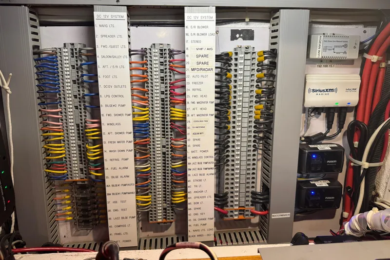 Slide: The Image of Electrical panel of a 2007 Hylas H49 yacht with labeled wiring and marine equipment. - 27