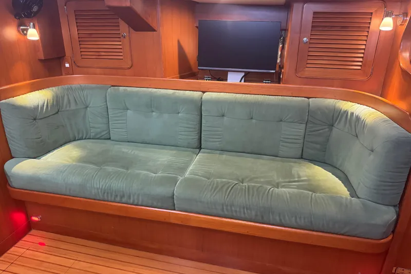 Slide: The Image of Luxurious green sofa in the cabin of a 2007 Hylas H49 yacht. - 21