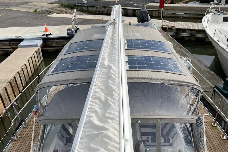 Slide: The Image of 2007 Hylas H49 yacht with solar panels on deck, docked at marina. - 65