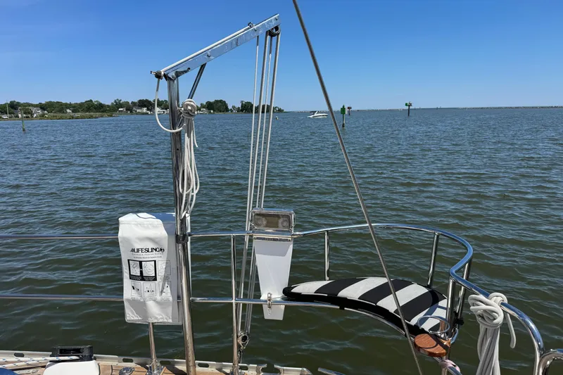 Slide: The Image of Sailing on a 2007 Hylas H49 yacht with lifesaving equipment, calm waters, and clear skies. - 66