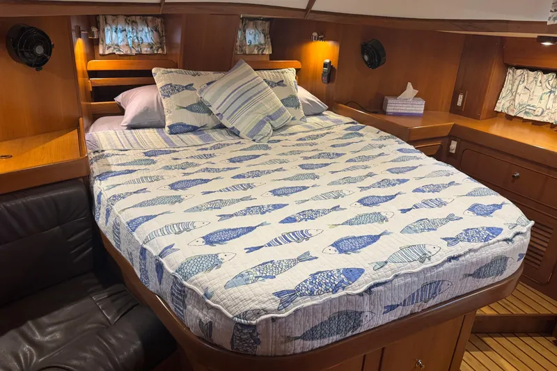 Slide: The Image of Cozy cabin interior of 2007 Hylas H49 yacht with fish-patterned bedding. - 36