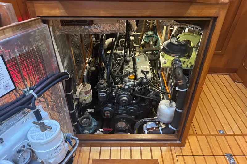 Slide: The Image of Engine room of a 2007 Hylas H49 yacht, showcasing detailed mechanical components. - 45