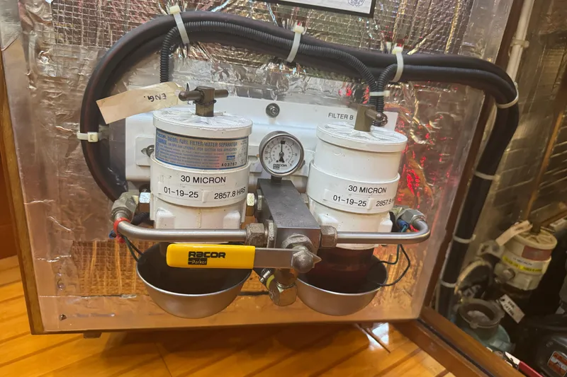 Slide: The Image of Dual diesel fuel filters in a 2007 Hylas H49 yacht engine room. - 48