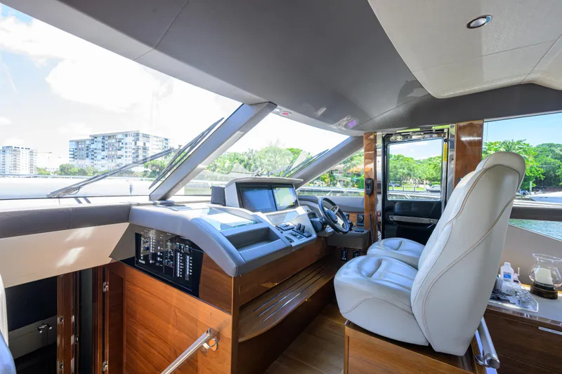 Slide: The Image of Luxurious 2020 Princess F70 yacht cockpit with modern controls and plush seating. - 24