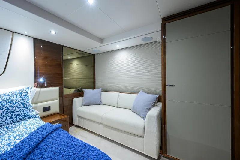 Slide: The Image of Luxurious interior of 2020 Princess F70 yacht with elegant bedding and cozy seating. - 38