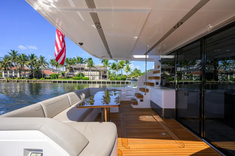 Slide: The Image of Luxurious 2020 Princess F70 yacht deck with elegant seating and scenic waterfront view. - 62
