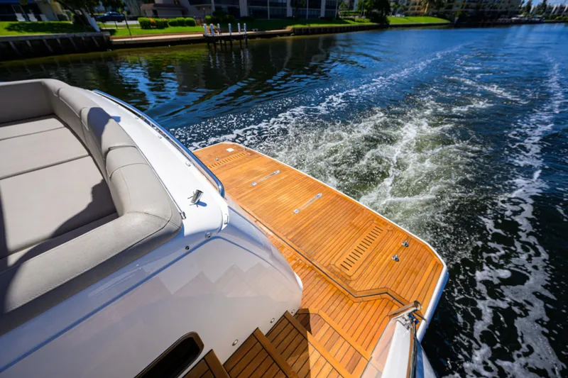 Slide: The Image of Luxury Princess F70 yacht cruising on a sunny day, showcasing elegant teak deck. - 63