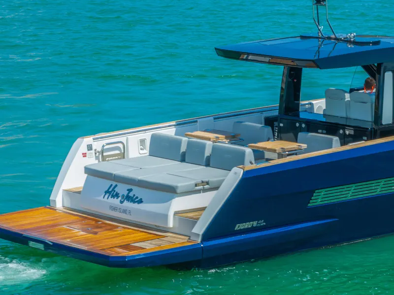 Slide: The Image of 2022 Fjord 44 Open yacht with sleek design on turquoise water. - 14