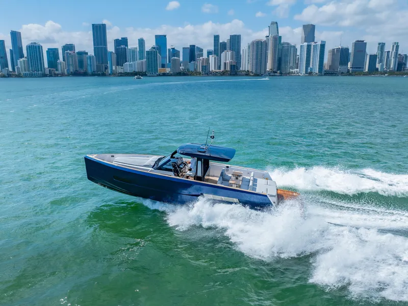 Slide: The Image of 2022 Fjord 44 Open cruising near a city skyline on a sunny day. - 15