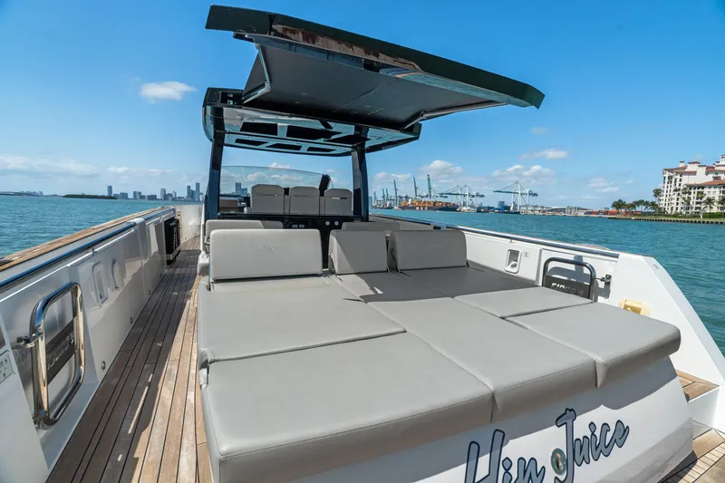 Slide: The Image of 2022 Fjord 44 Open yacht with spacious deck and sunbathing area, docked by the waterfront. - 23