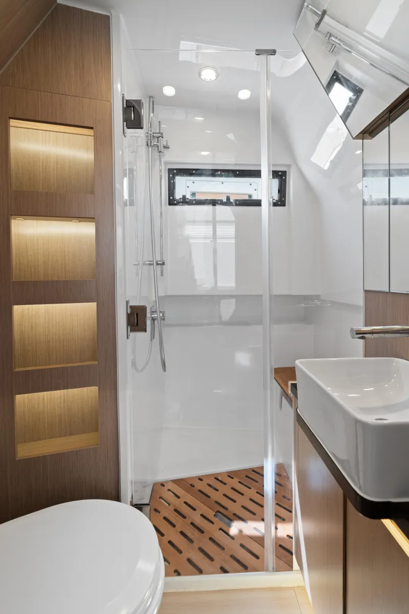 Slide: The Image of Modern bathroom interior of 2022 Fjord 44 Open yacht, featuring sleek design and wooden accents. - 40