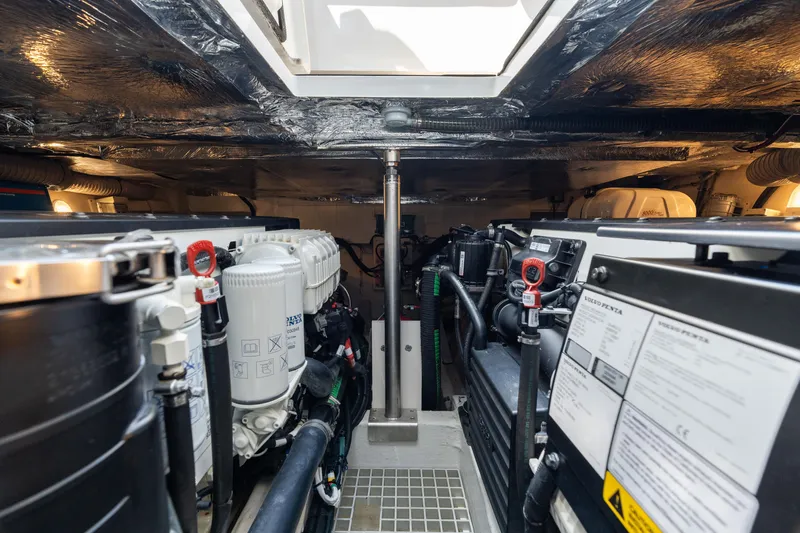 Slide: The Image of Engine room of 2022 Fjord 44 Open yacht, showcasing mechanical components and systems. - 44