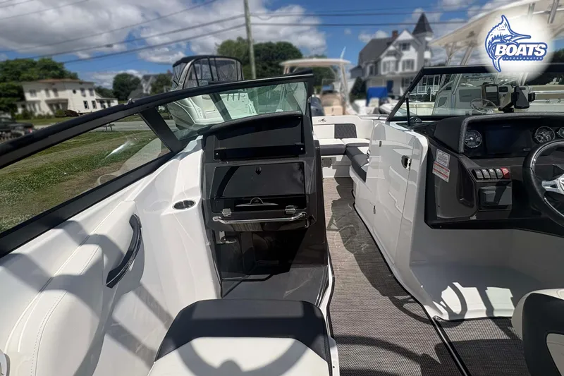 Slide: The Image of 2020 Monterey M-65 boat interior with sleek design and modern dashboard controls. - 8