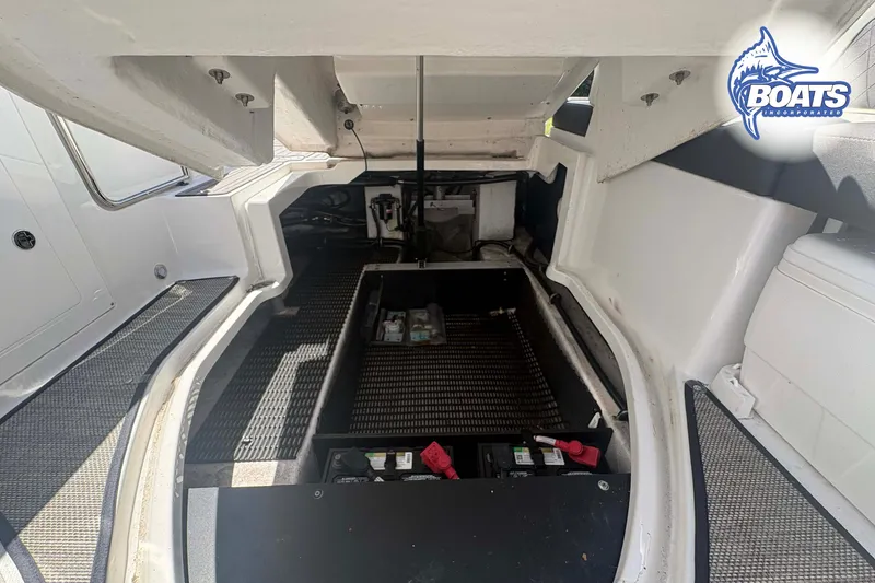 Slide: The Image of Engine compartment of a 2020 Monterey M-65 boat, showcasing interior details and components. - 12