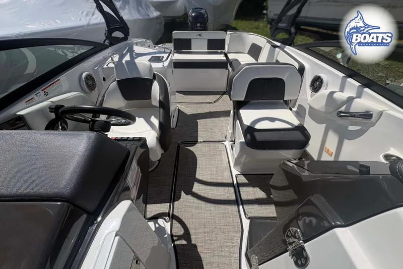 Slide: The Image of Interior view of a 2020 Monterey M-65 boat, featuring sleek seating and modern controls. - 10