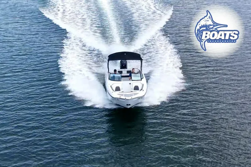 Slide: The Image of 2020 Monterey M-65 boat cruising on water, Boats Incorporated logo visible. - 1