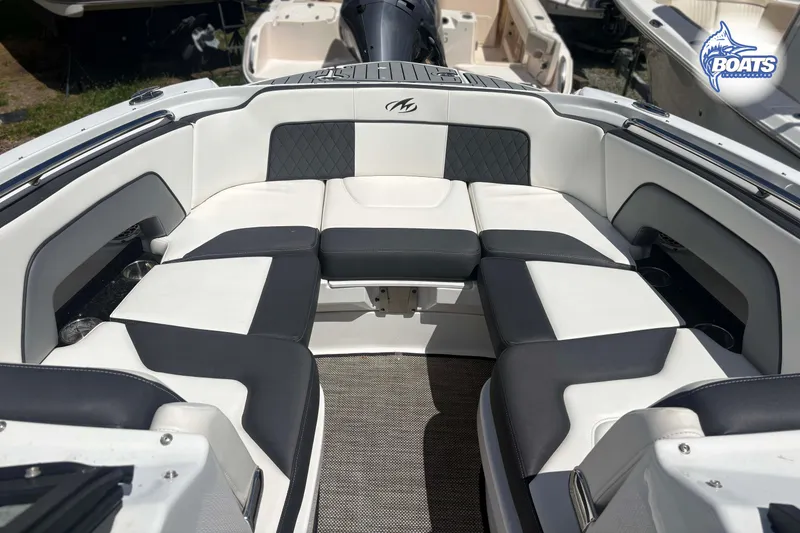 Slide: The Image of 2020 Monterey M-65 boat interior with cushioned seating and elegant design. - 4