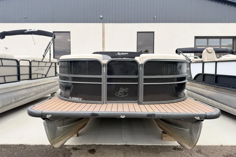 Slide: The Image of 2019 Misty Harbor 2285CF pontoon boat displayed at a dealership. - 1