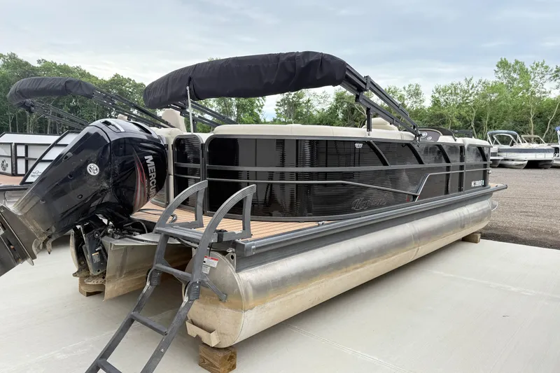 Slide: The Image of 2019 Misty Harbor 2285CF pontoon boat with Mercury outboard motor, docked outdoors. - 3