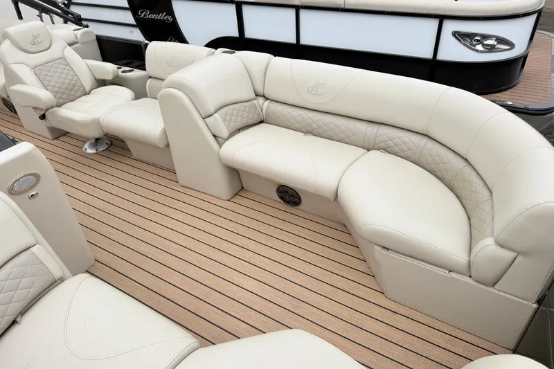 Slide: The Image of Luxurious seating on 2019 Misty Harbor 2285CF pontoon boat with beige upholstery and striped flooring. - 6
