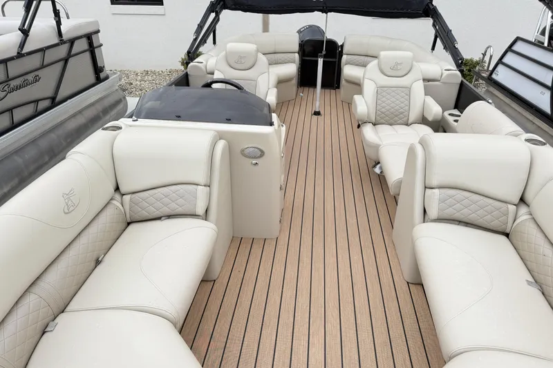 Slide: The Image of 2019 Misty Harbor 2285CF pontoon boat with luxurious beige seating and spacious deck layout. - 7