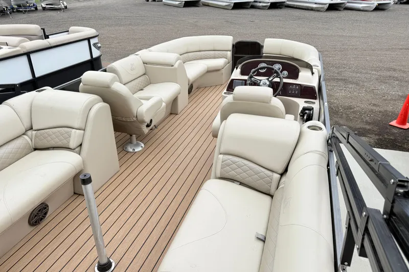 Slide: The Image of Luxurious 2019 Misty Harbor 2285CF pontoon boat interior with plush seating and modern dashboard. - 9