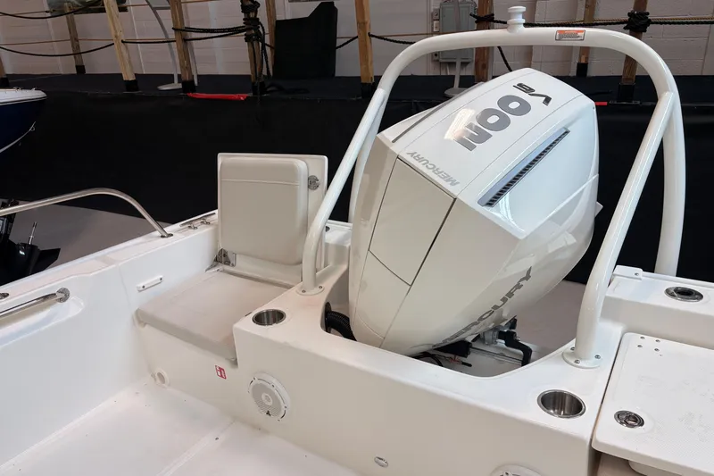 Slide: The Image of 2026 Boston Whaler 210 Montauk boat with Mercury outboard engine, interior view. - 6