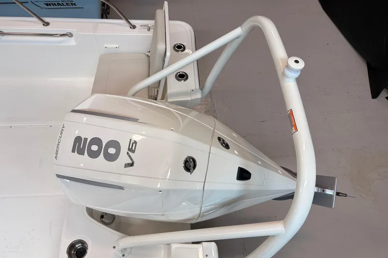 Slide: The Image of 2026 Boston Whaler 210 Montauk with Mercury 200 V6 outboard engine, rear view. - 7