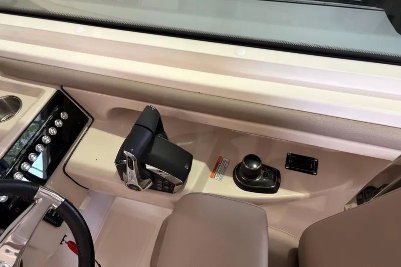 Slide: The Image of 2026 Boston Whaler 330 Vantage helm with controls and joystick, showcasing modern design. - 20