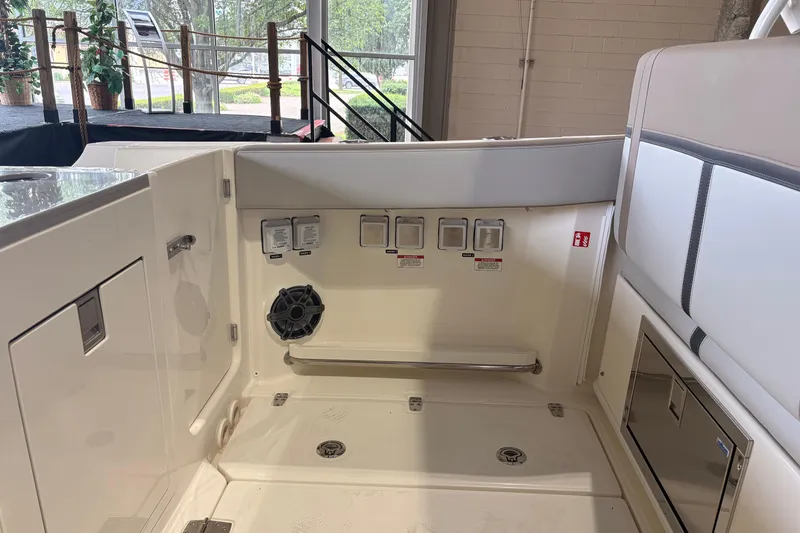 Slide: The Image of Interior view of 2026 Boston Whaler 330 Vantage boat, showcasing seating and control panel. - 22