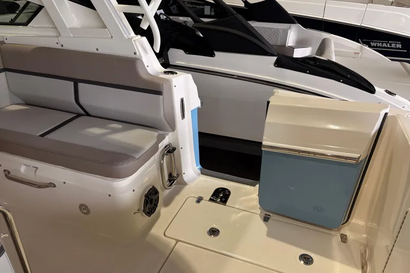 Slide: The Image of 2026 Boston Whaler 330 Vantage interior with seating and open door detail. - 26