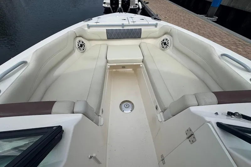 Slide: The Image of 2020 Cobia 280 Dual Console boat interior with spacious seating and modern design. - 13